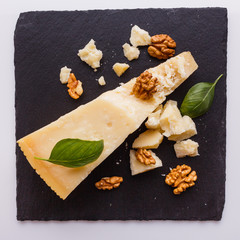 fragrant Parmesan on a slate stone slicing board