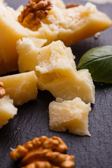 fragrant Parmesan on a slate stone slicing board
