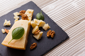fragrant Parmesan on a slate stone slicing board