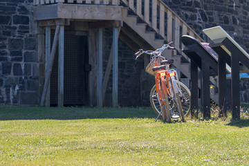Two bicycles by sign in summer sun, Prince Of Wales Tower, Halifax, history, summer sun, no people, stone building, military