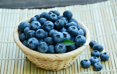 Blueberries in basket with Scotch pattern  on wooden floor.
Blueberries are Low in Calories, But High in Nutrients.