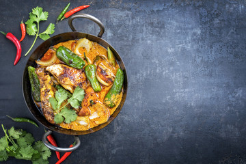 Traditional Thai kaeng massaman coconut chicken curry with jalapeno, poblano chili and sweet...