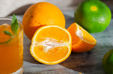 Freshly squeezed orange juice, and orange , close-up