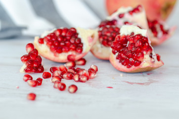 Pieces of pomegranate fruit on white background