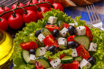 Greek salad on a wooden rustic background