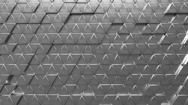 Abstract looping motion background texture of metallic triangles.