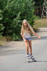 The girl rides on roller skates