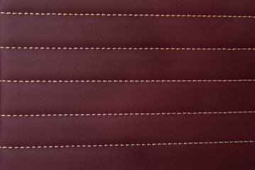 red leather Mat with straight stitching soft leather machine foot textured pattern collection concept background fabric business