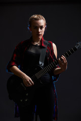 Blonde woman rocker guitarist black dark scene