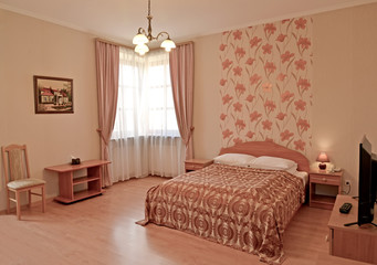  A bedroom interior in pink tones. Modern classics