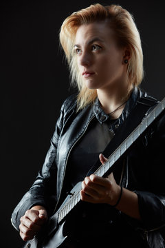 Blonde woman rocker guitarist black dark scene