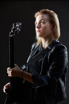 Blonde woman rocker guitarist black dark scene