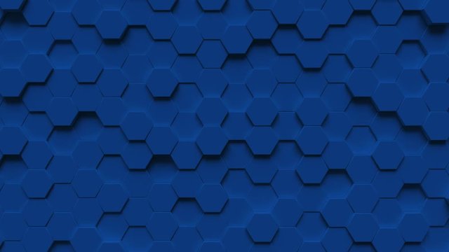 Abstract looping motion background texture of blue hexagons.