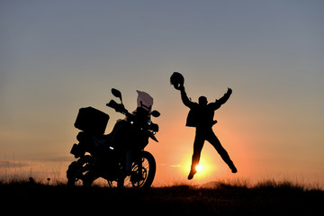 Fototapeta na wymiar energetic motorcyclist and adventure time
