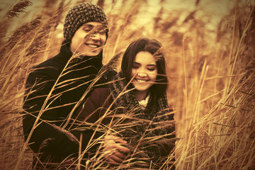 Happy young fashion couple in love walking outdoor