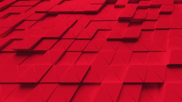 Abstract looping motion background texture of red triangles.