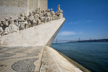Monument to the Discoveries (Padrao dos Descobrimentos) at the Tagus river with view on 25th of April Bridge © msnobody
