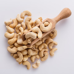 cashew nuts on a white acrylic background