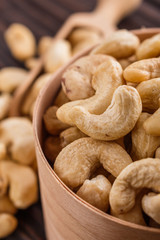 cashew nuts on a rustic wooden background