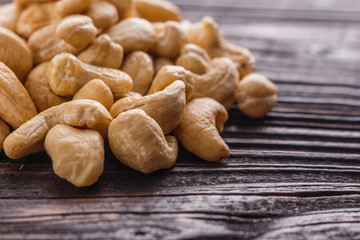 cashew nuts on a rustic wooden background