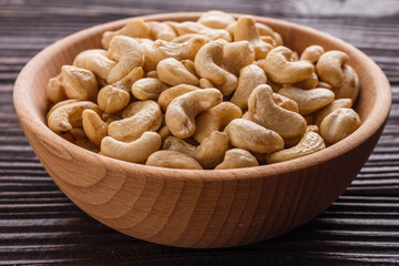 cashew nuts on a rustic wooden background