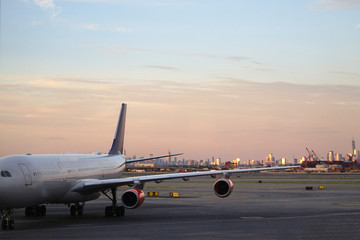 Naklejka na ściany i meble New York city with airplane in front.