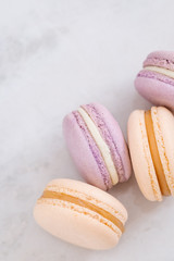 Pastel French macarons on white table