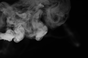 White smoke on a black background. Texture of smoke. Clubs of wh