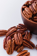 delicious pecan nuts on a white acrylic background
