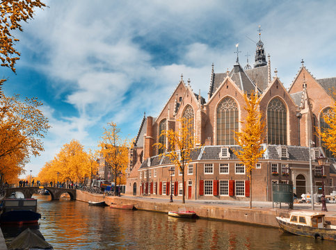 Oude Kerk over canal at spring day, Amsterdam at fall, Holland