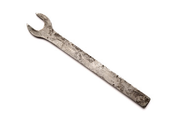 Old wrench isolated on white background.