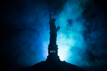 Silhouette statue of liberty on dark toned foggy background. Statue of Liberty on the background of...