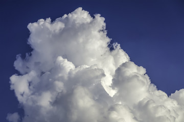 white cloud in dark blue sky