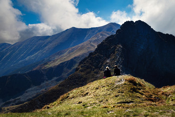 two figures in high mountains