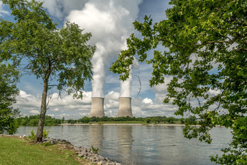 Recreation area park with nuclear cooling towers with reflection in lake