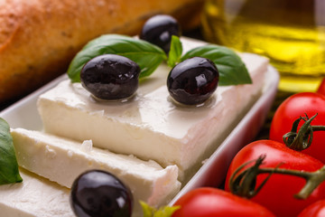 A piece of feta cheese on a wooden rustic background