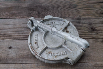 Cast iron Mexican tortiilla press (tortilladora) - used for forming corn tortillas from balls of masa (nixtamal)
