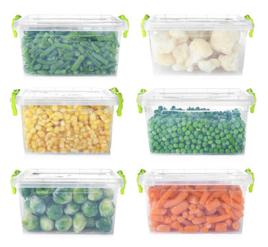 Set with frozen vegetables in plastic containers on white background