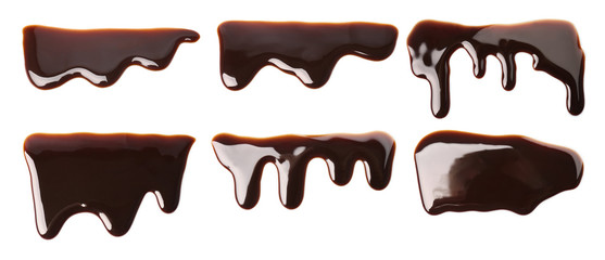Set with molten chocolate flowing on white background