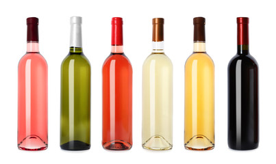 Obraz na płótnie Canvas Set with different blank wine bottles on white background