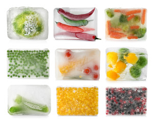 Set with vegetables and berries frozen in ice cubes on white background