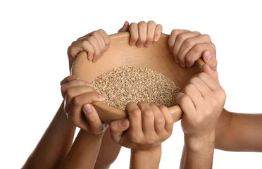  Poor people holding wooden bowl with grains on white background, closeup © New Africa