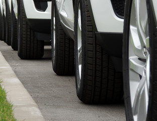 Convoy of the white vehicles pulling out from parking 