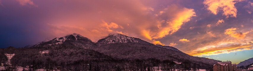 beautiful panorama of the mountains in the winter at sunset