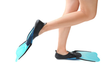 Woman wearing blue flippers on white background, closeup