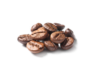 Pile of roasted coffee beans on white background