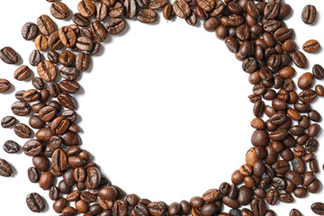 Frame made of roasted coffee beans on white background, top view