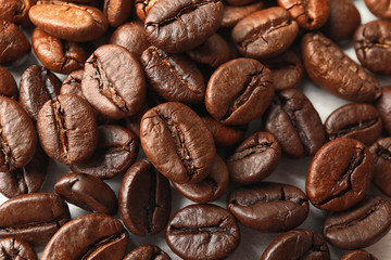 Roasted coffee beans as background, top view
