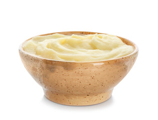 Bowl with tasty mashed potatoes on white background