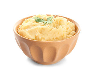 Bowl with tasty mashed potatoes on white background